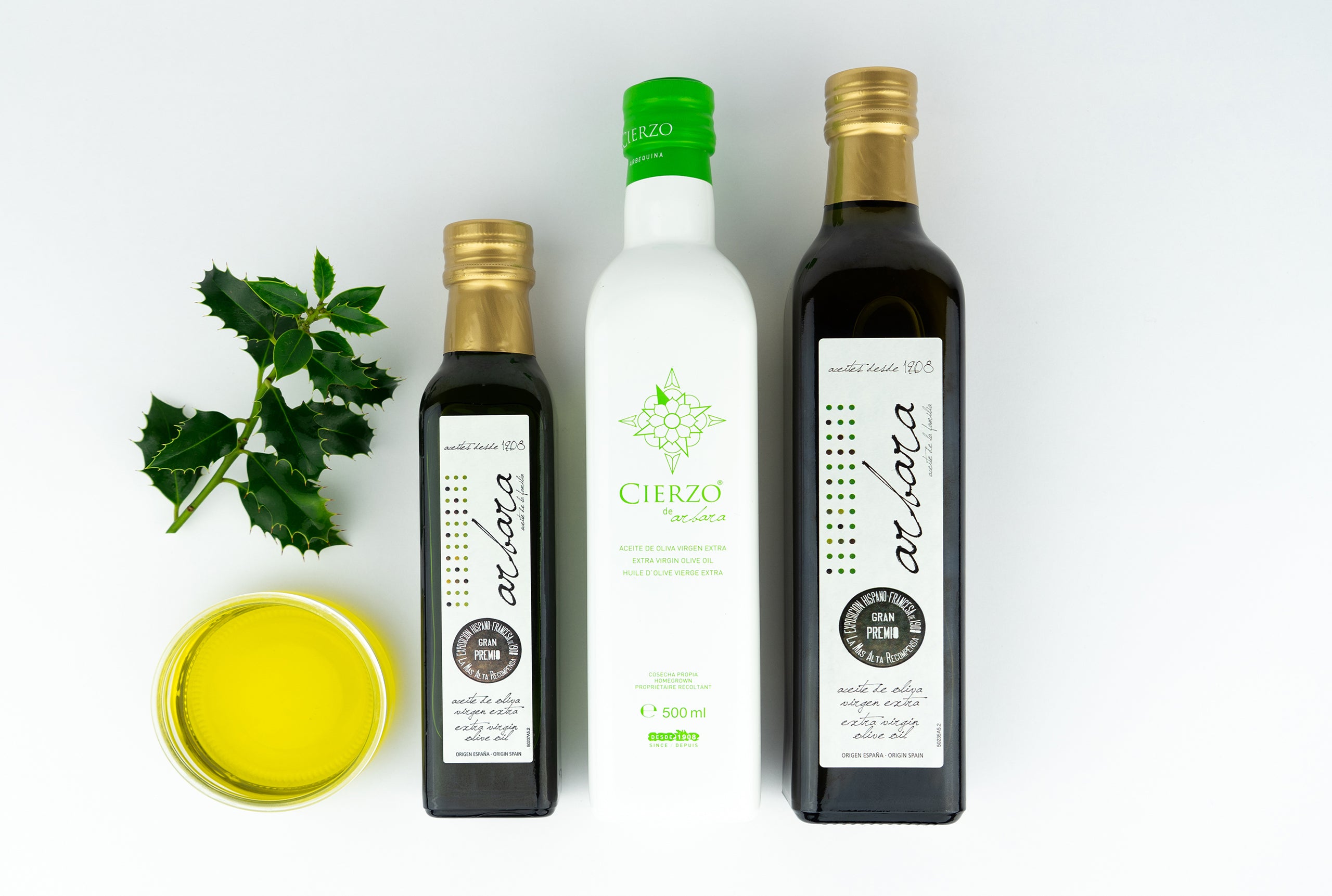 Botellas de aceite de oliva virgen Arbara y Cierzo con hoja decorativa y cuenco